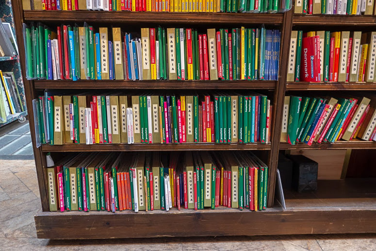 colorful travel guide books at Daunt Books