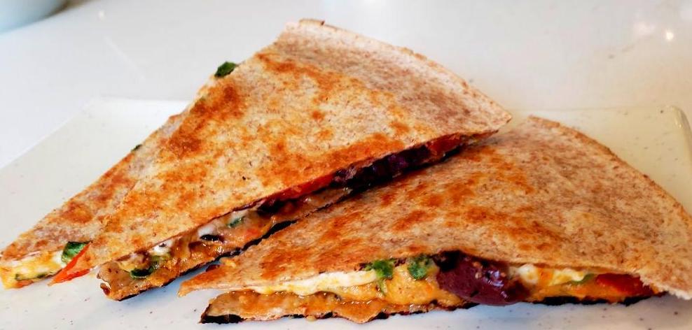 Plate with slices of roasted red pepper quesadilla