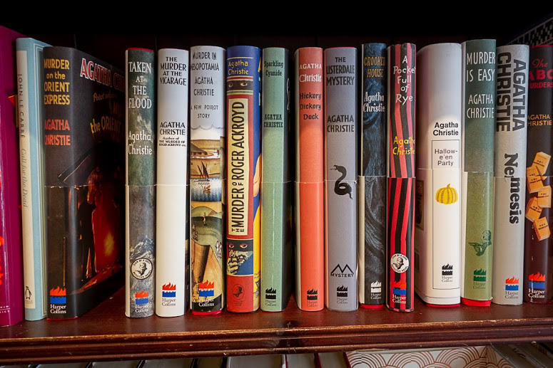 retro style Agatha Christie novels on a bookshelf
