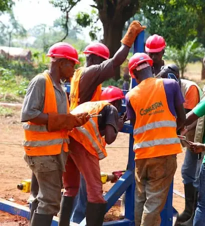 A Concern team assembles a mobile drilling kit