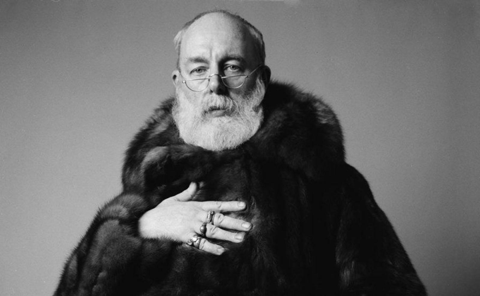 black and white portrait of edward gorey in a fur coat