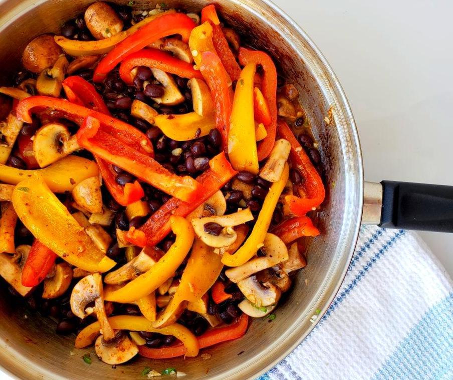 Pan with fajita peppers, mushroom, and black beans