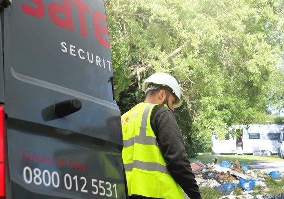 site operative removing rubbish after travellers