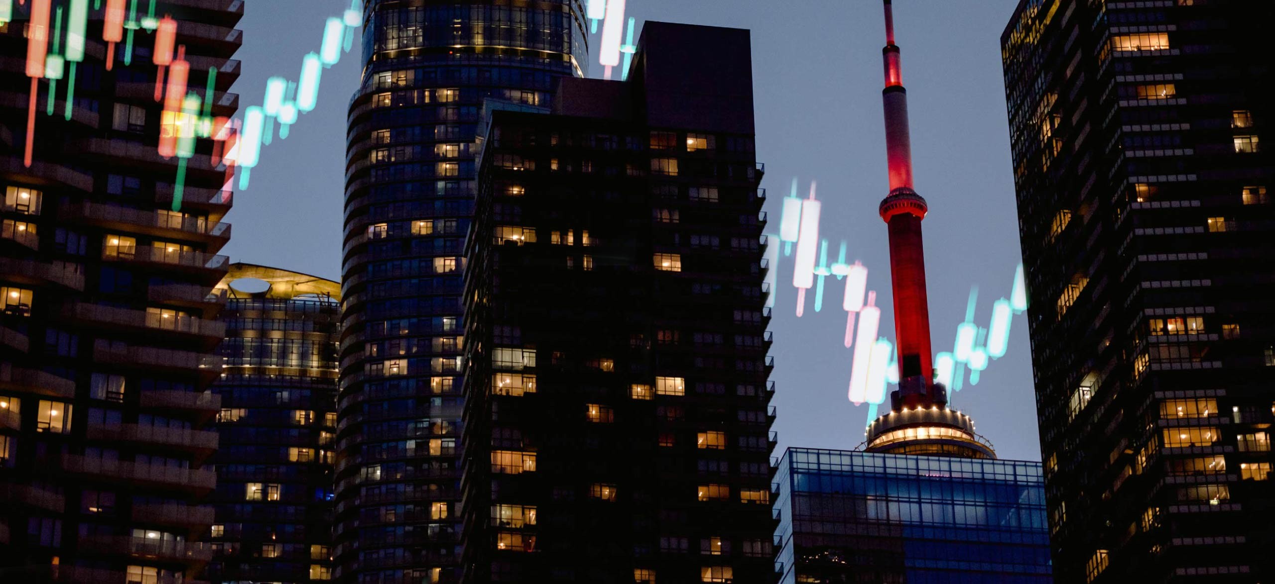 Downtown Toronto and the CN tower at illuminated at night.