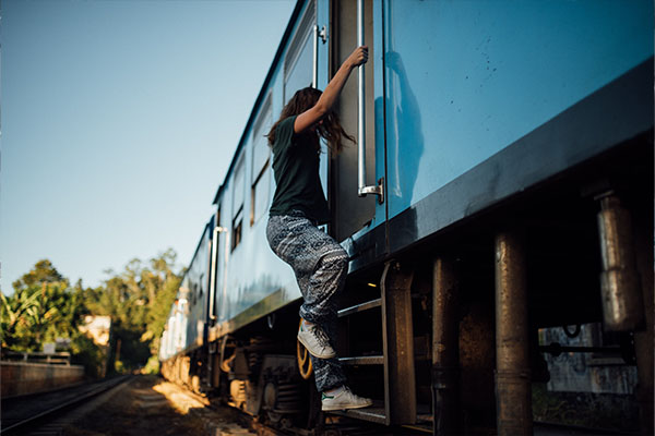 backpacker escaping toxic job on a train
