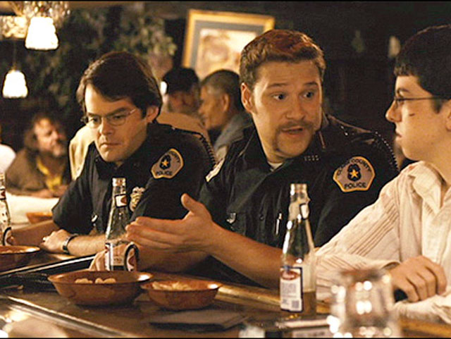 McLovin and the Superbad Cops are drinking beers at the local bar