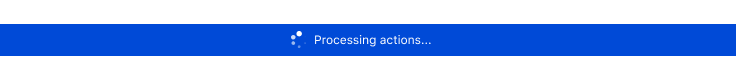 a blue bar with a loading indicator and the text "Processing actions..."
