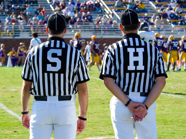 The Side Judge and Head Linesman officiating an American Football game