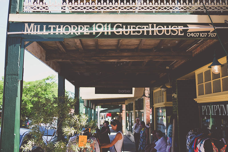 People sitting in the porch of a Guesthouse