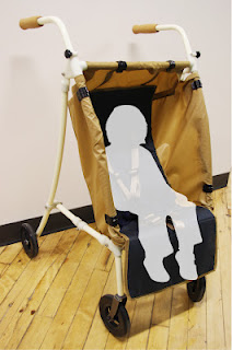 The Mainframe with fabric draped over its structure, as a proposed stroller adaptation