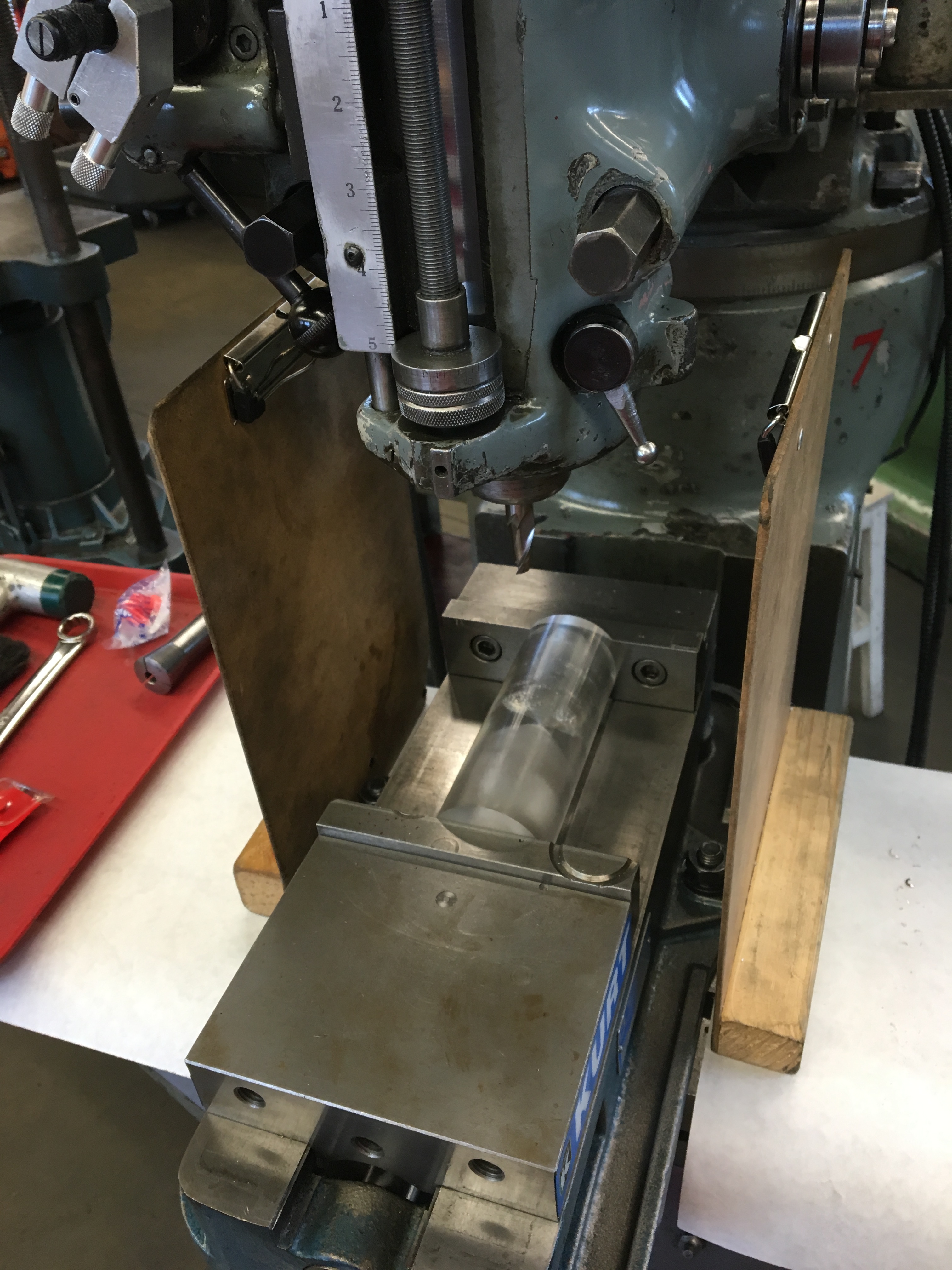 Setup for drilling inset slots in the hourglass