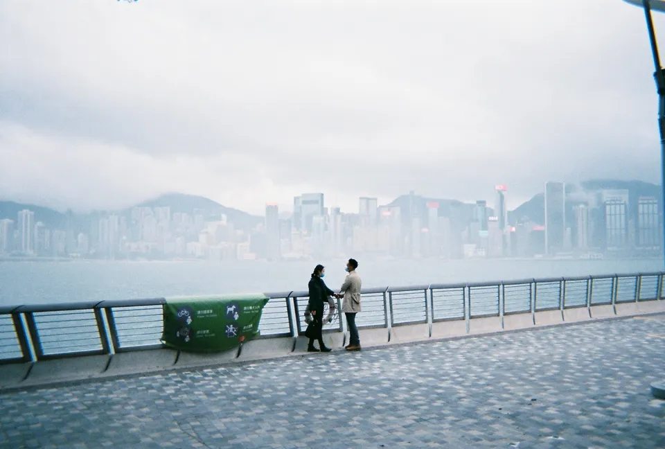 Couple holding hands in Tsim Sha Tsui