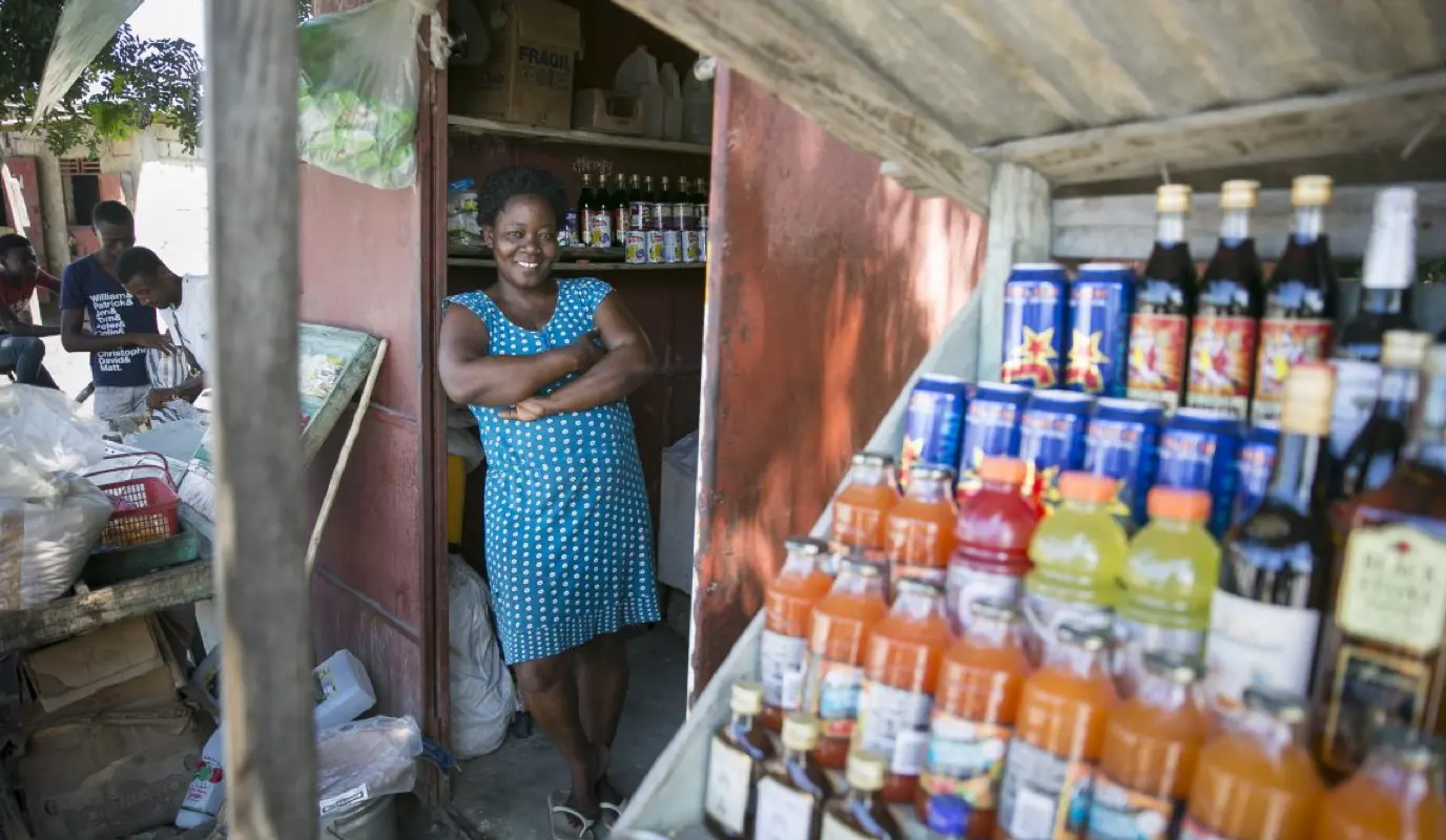 Woman standing in her shop with all her items