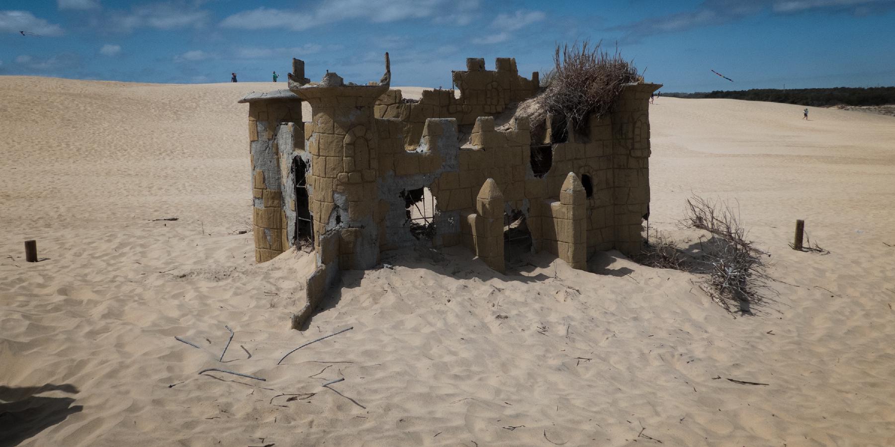 The ruins of a miniature golf castle peak out of the dunes of Jockeys Ridge in Nags Head, North Carolina.