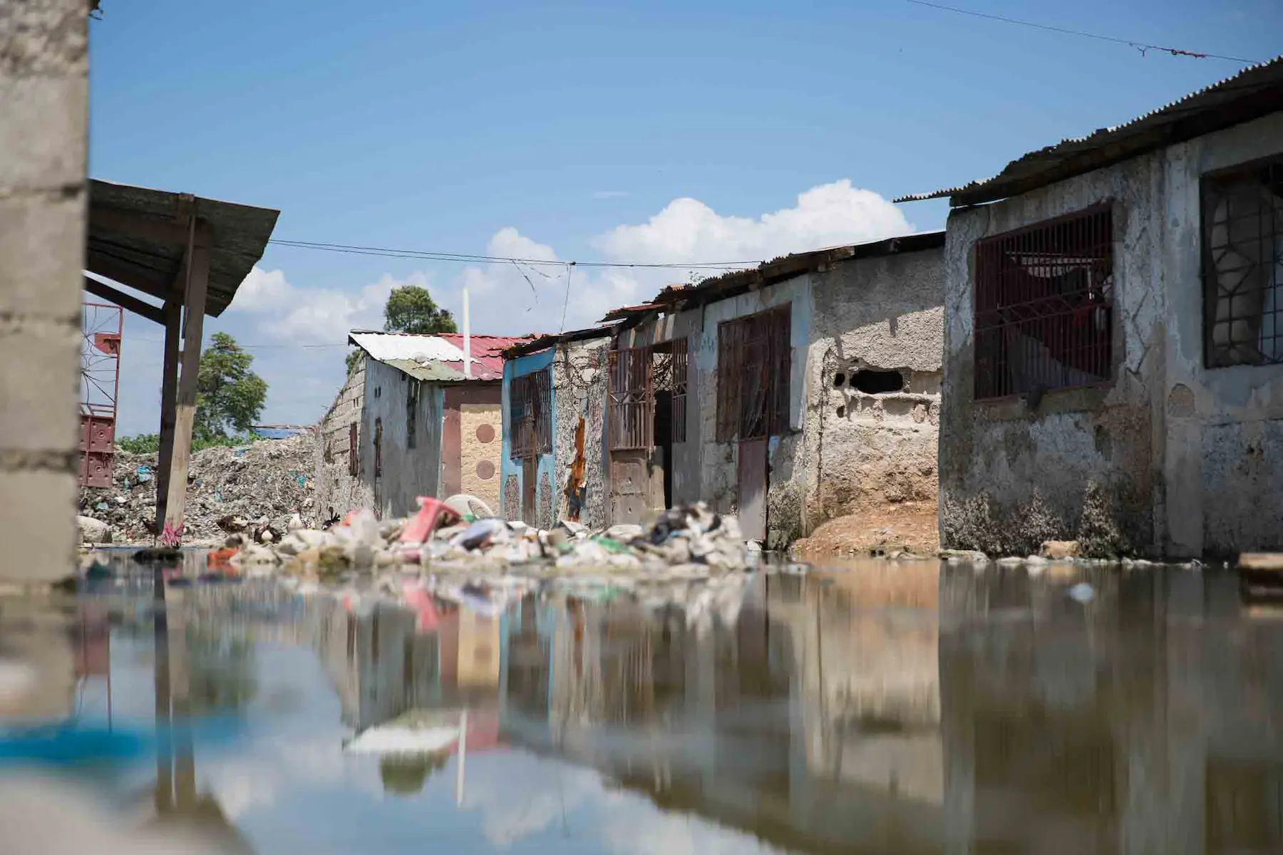A flooded street in a Haitian urban slum