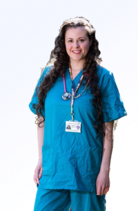 Dr Saskia Fauguel smiling in doctor scrubs with a light blue background