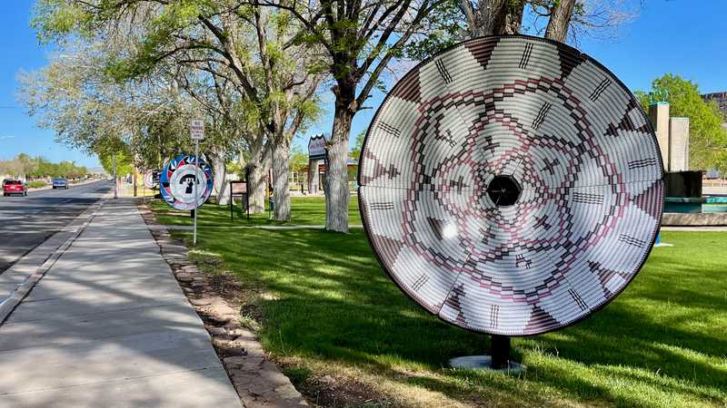 Satellite dishes that were painted to look like Native American baskets and pottery bowls