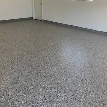 new epoxy flooring installed on a concrete garage floor