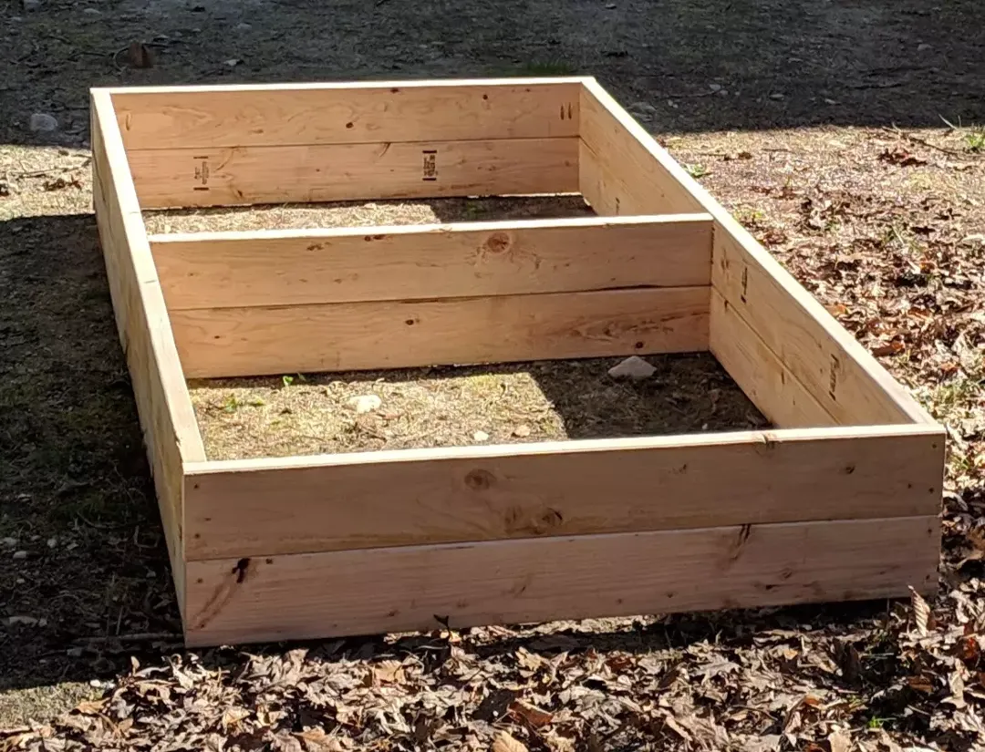 Raised garden bed without soil.