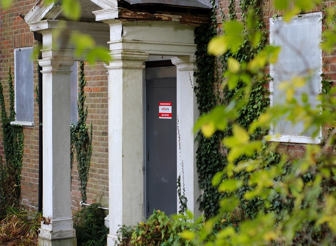 steel security door with greenery surrounding