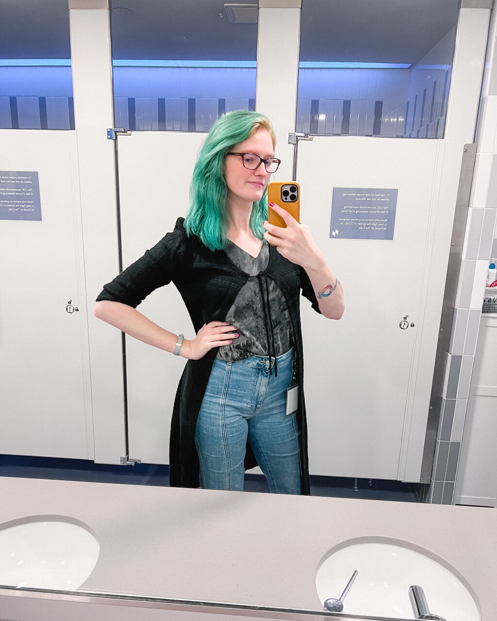 Another mirror selfie. Beth's wearing a long black cardigan (almost a cape) over jeans and a blouse