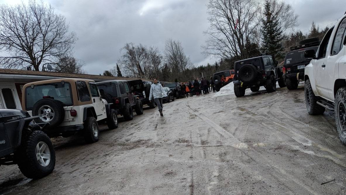 Arianne Gervais walking among Jeeps