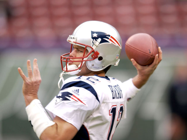 A close-up of Tom Brady, Quarterback of the New England Patriots, throwing a pass