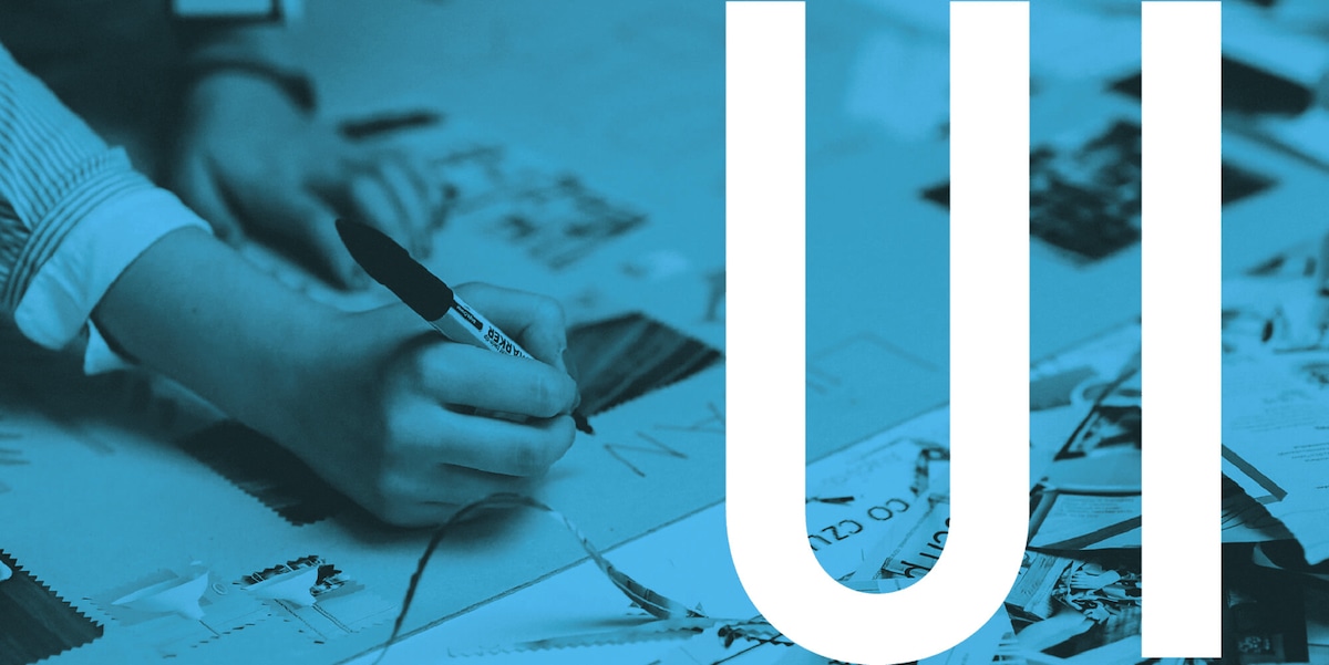 Becoming a UI designer Handwriting something on a piece of paper