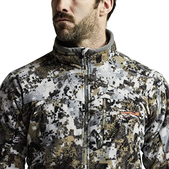 Someone wears a SITKA jacket, which is one of the best hunting jackets in 2022.