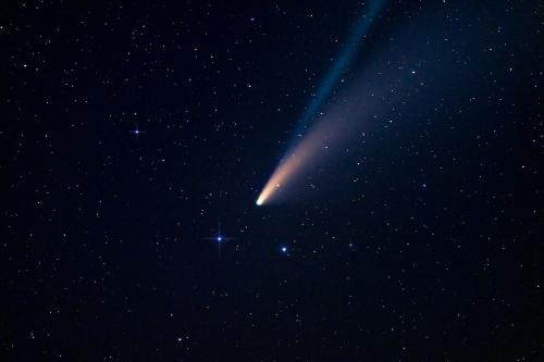 Thumbnail Comet shooting through starry night sky