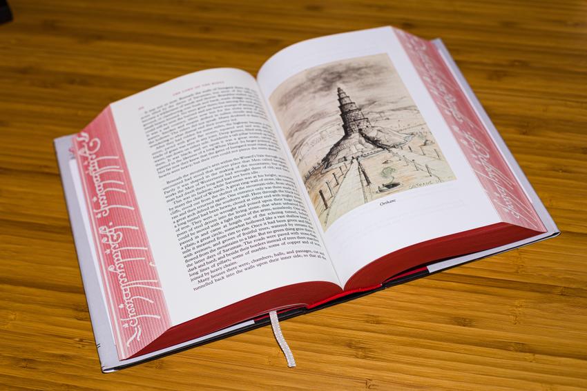 The book laid flat on a table on a page with an illustration of Orthanc
