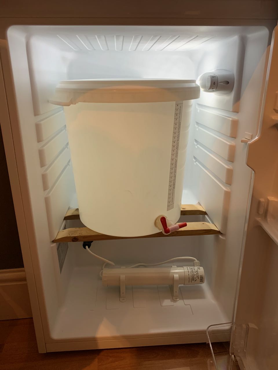 A modified fridge, showing the fermentation bucket fitting well