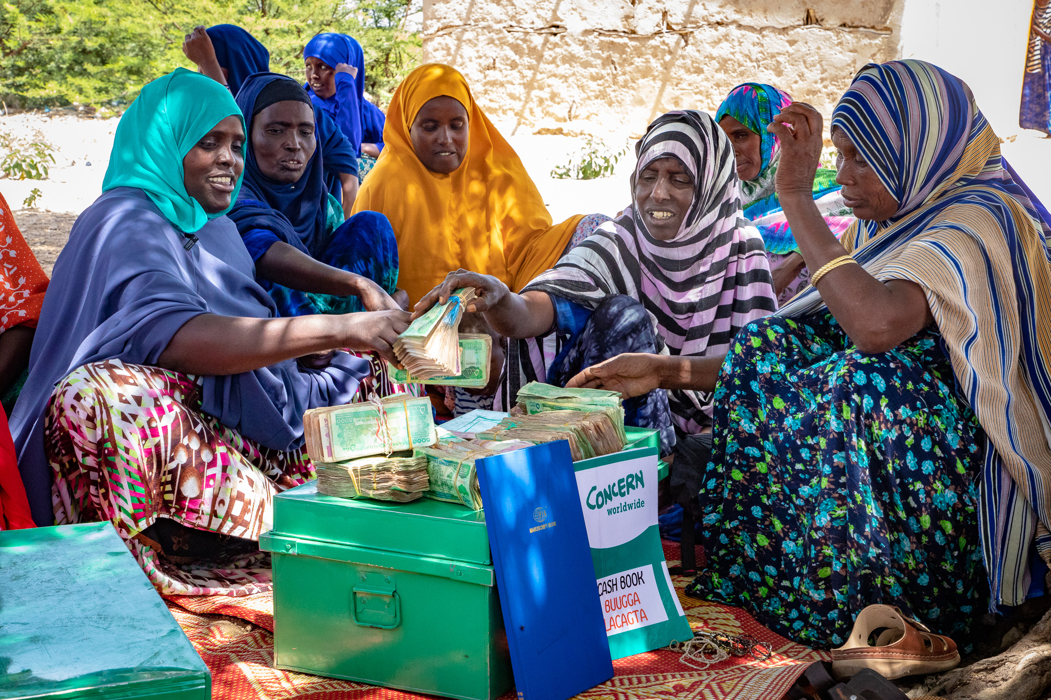 Members of a village savings and loans group in Somalia count their cash