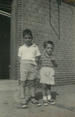 Circa 1960, Bill and I standing outside of our apartment building in Brooklyn.