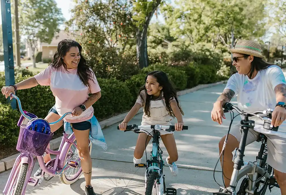 Young family having fun riding bikes together