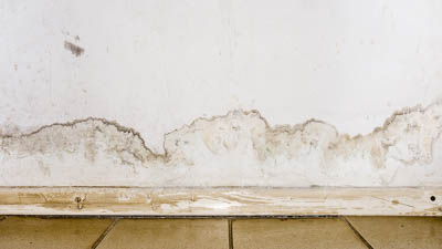 Baseboard water stains can indicate a slab leak