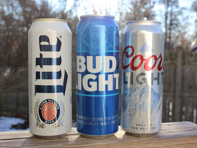 Three tallboy cans of Bud Light, Coors Light and Miller Lite