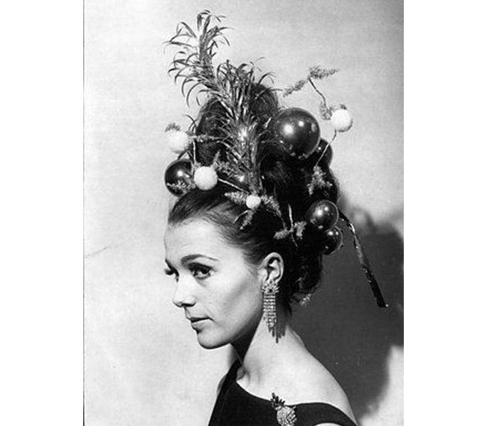 elaborate hairdo decorated with christmas balls