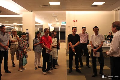 A photo Tan Swie Hien and a tour group.