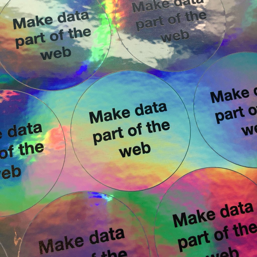 A sheet of circular make data part of the web stickers printed on holographic metallic material