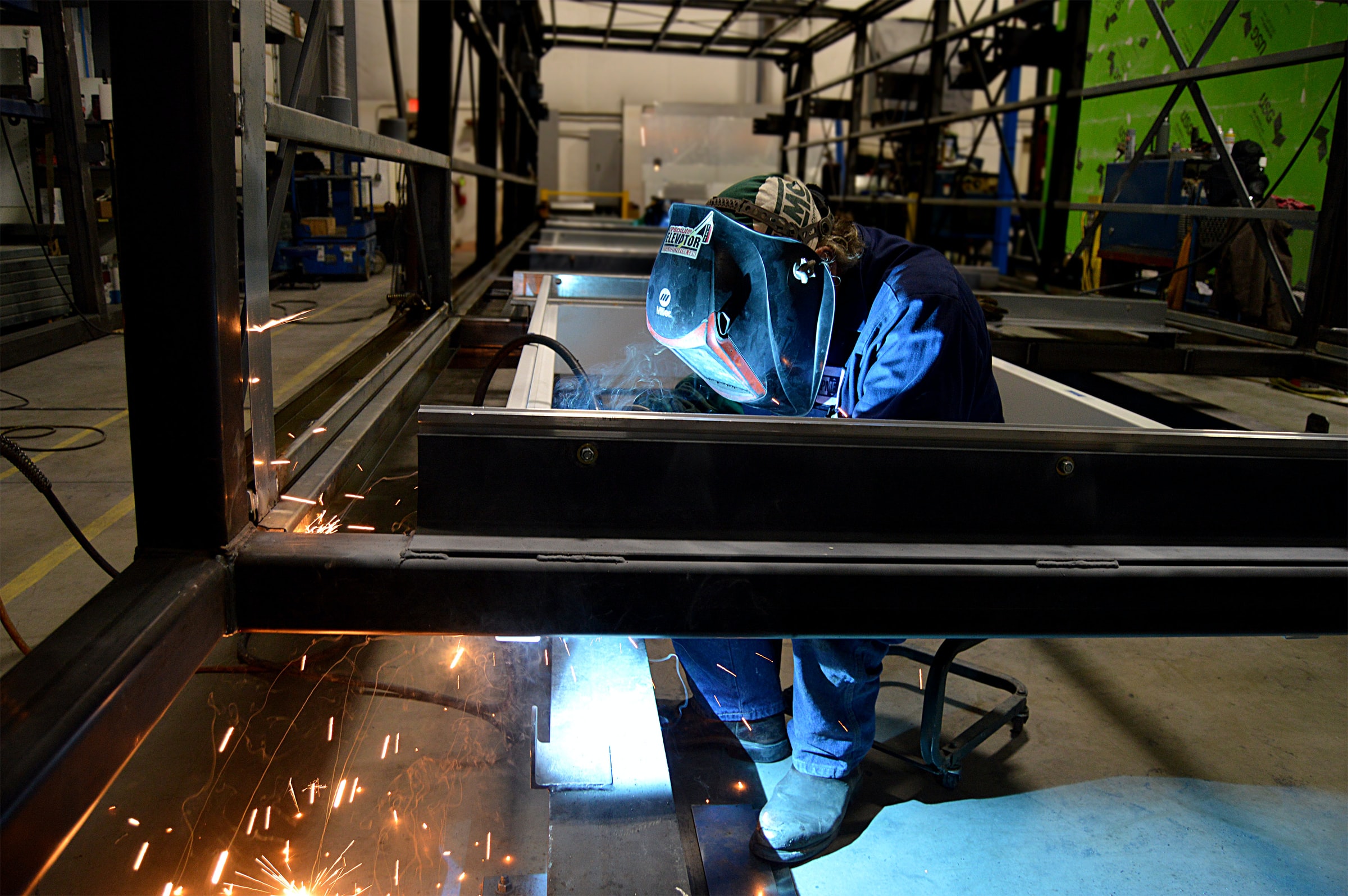 Welding robots are supplementing human welders within factories. Credit: Russ Ward on Unsplash