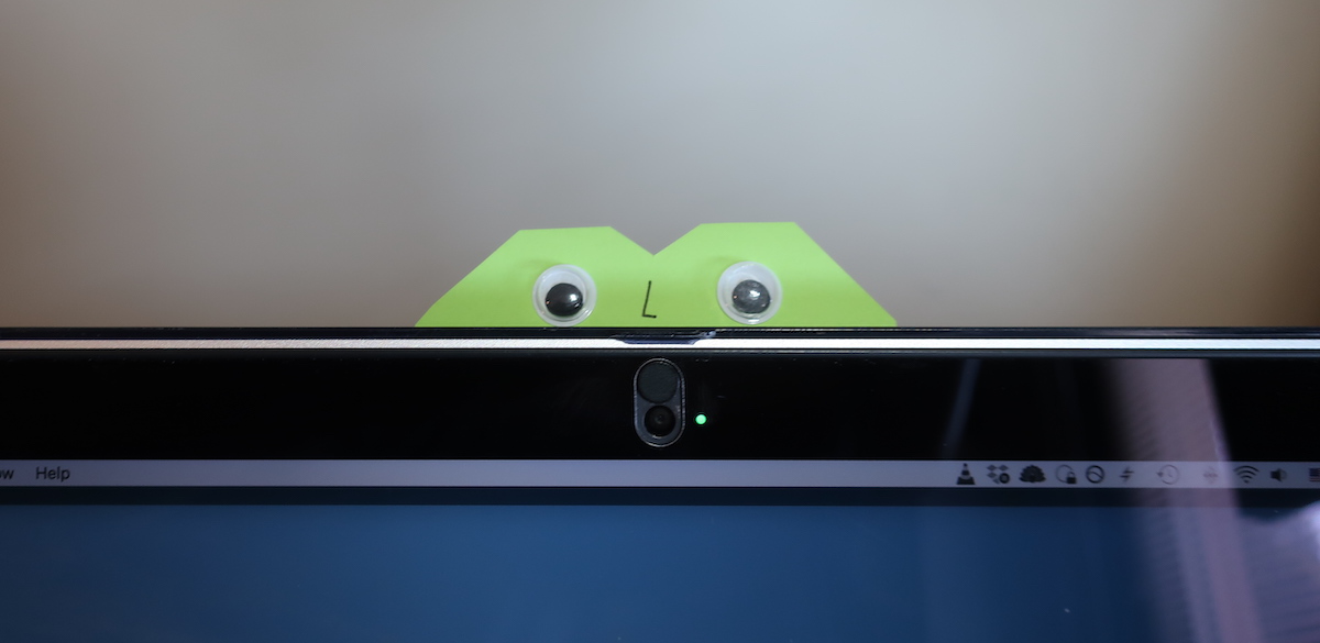 Sticky note monster with googly eyes on my webcam