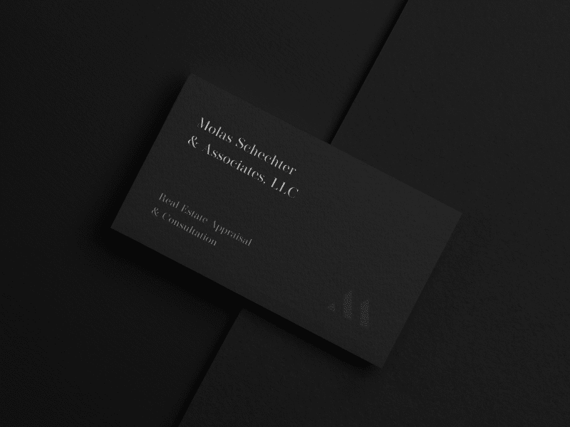 A cover image for Molas Schechter & Associates that shows a modern and sleek black business card design created for the client.