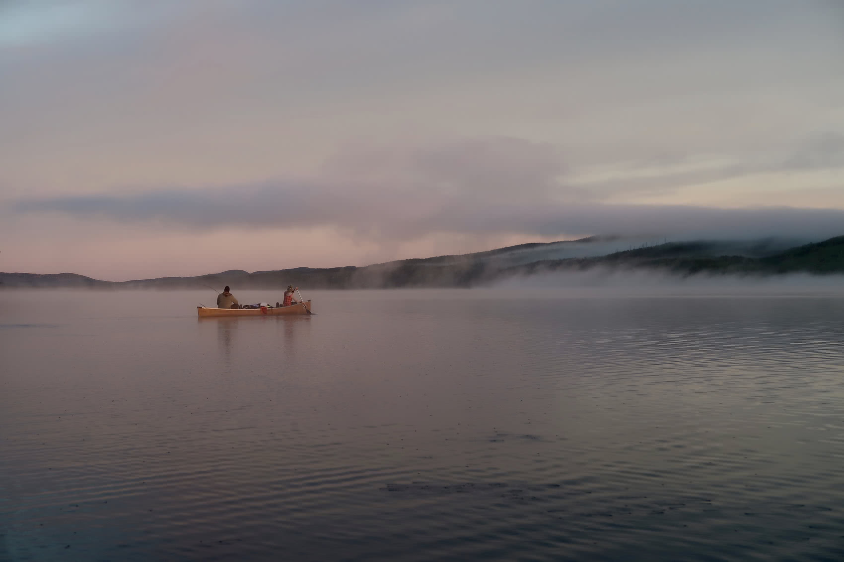 Paddling through the fog at sunrise