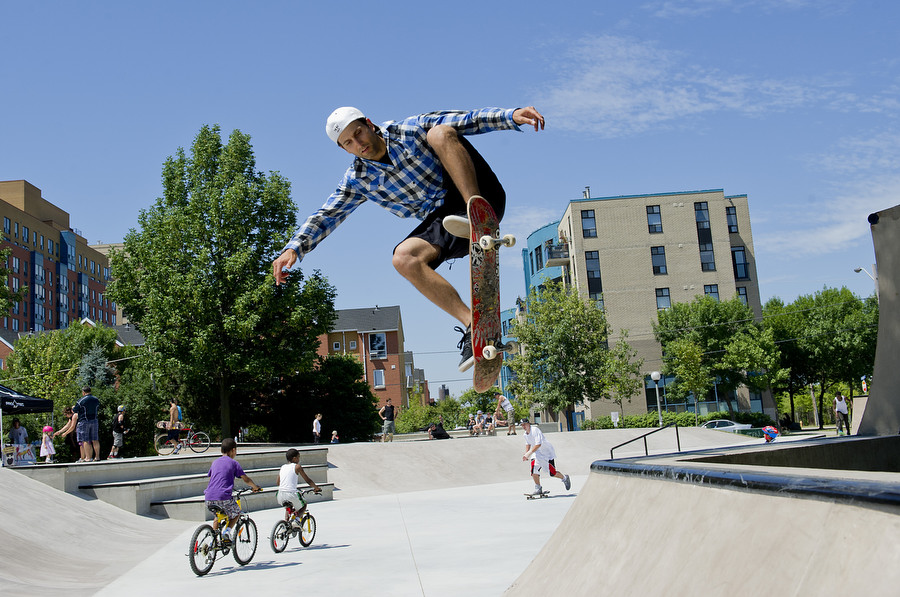 Skater Ariel Stagni "ollies" over a crest at a skate park in Toronto.