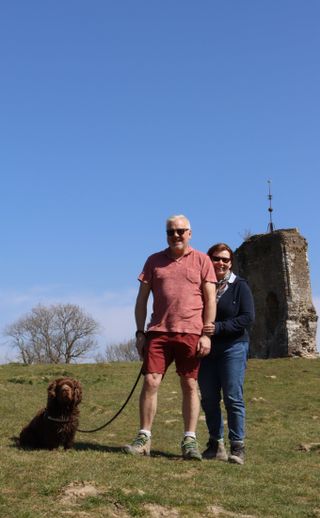 My parents and Bruno posing for a photo in front of Knepp castle