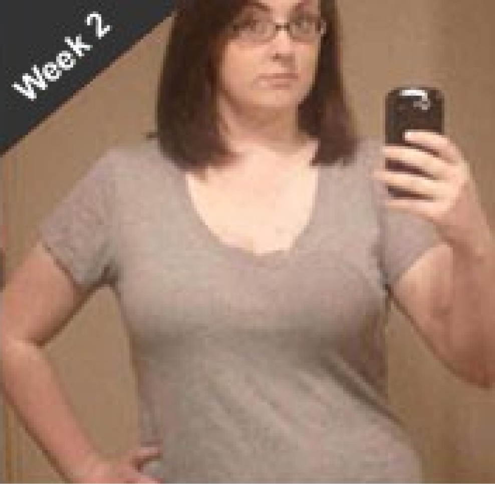 an over weight women taking a photo second week