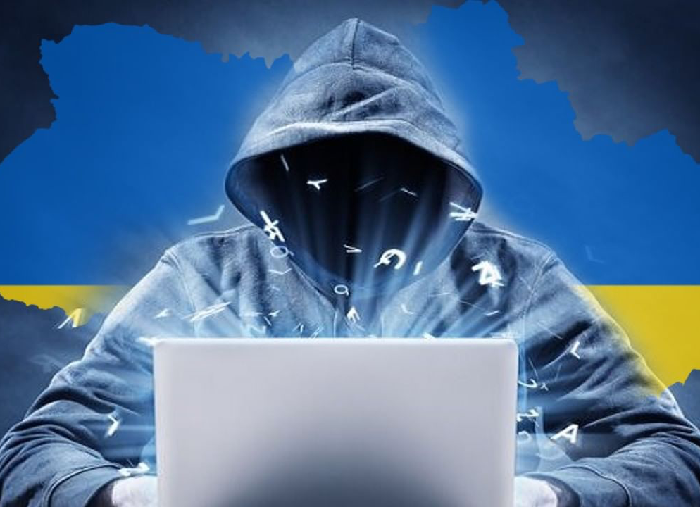 hacker at computer with ukraine in background