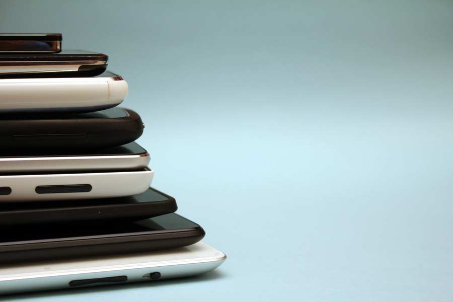 Stack of smartphones of various sizes