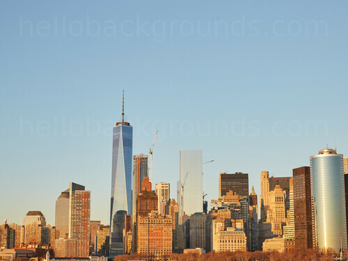 Urban cityscape at sunrise featuring various tall office buildings against clear sky Google Meet background